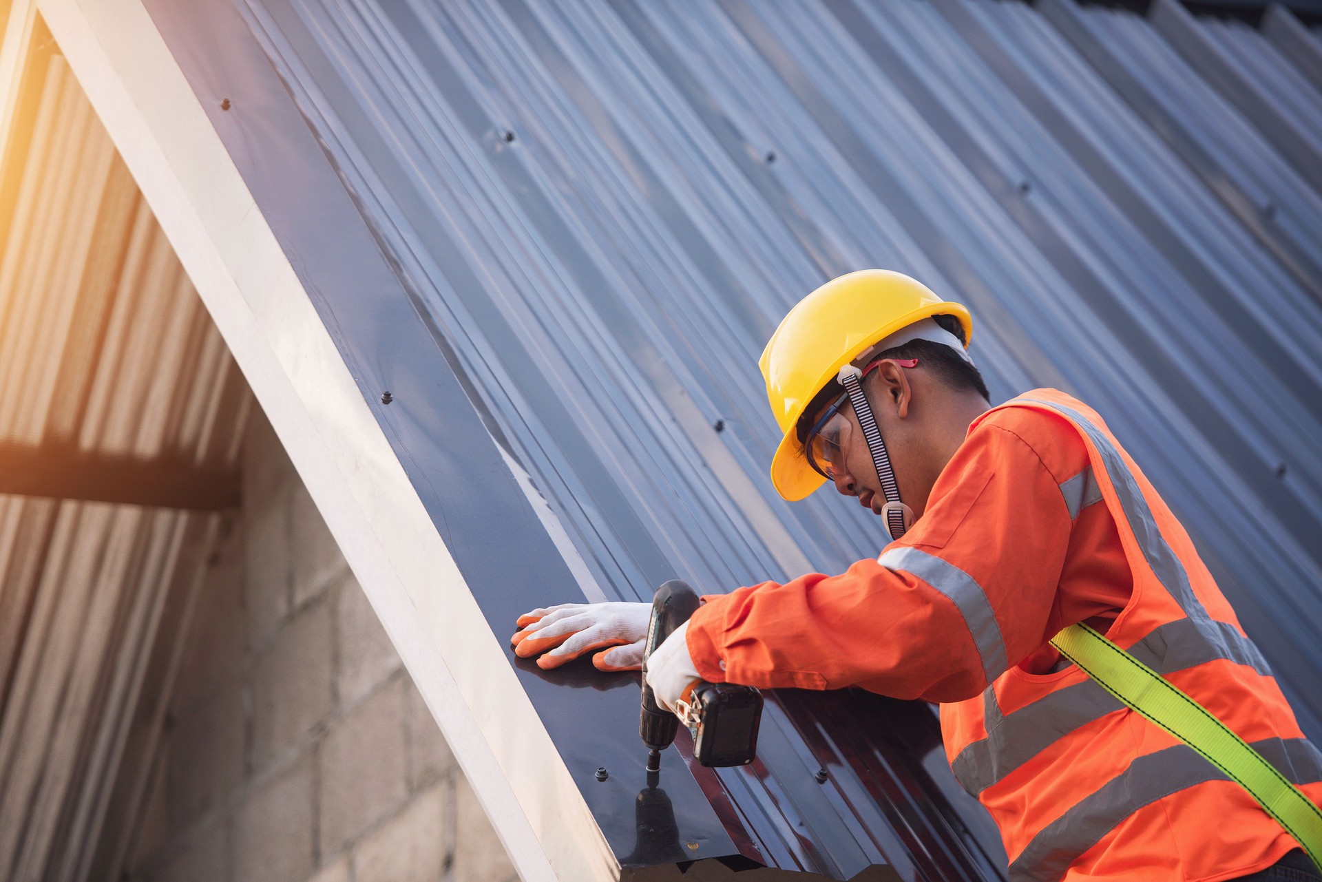 Construction worker install new roof